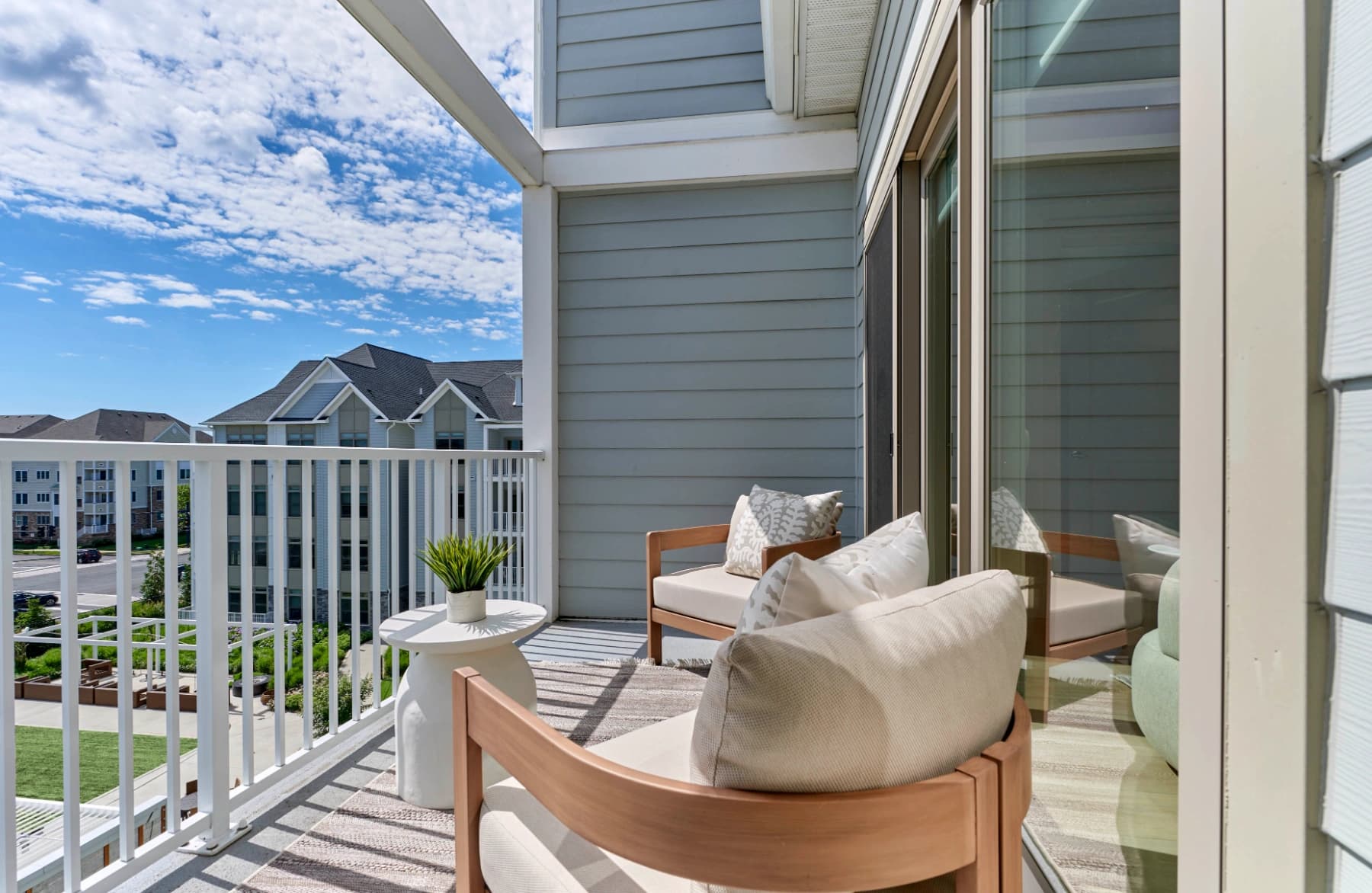 Private balcony at a Liora residence with outdoor seating