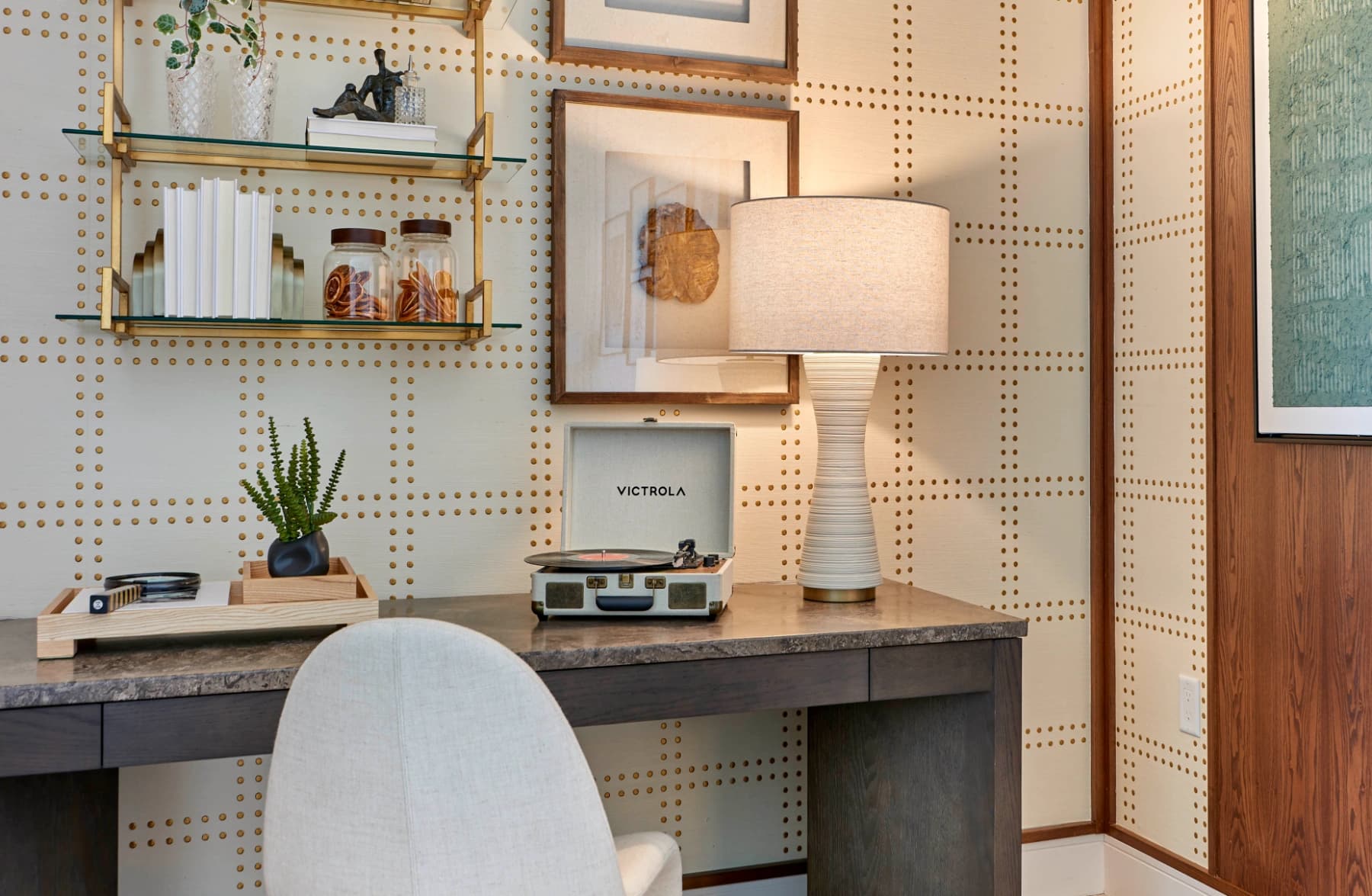 Styled Liora residence workspace with shelving and a record player