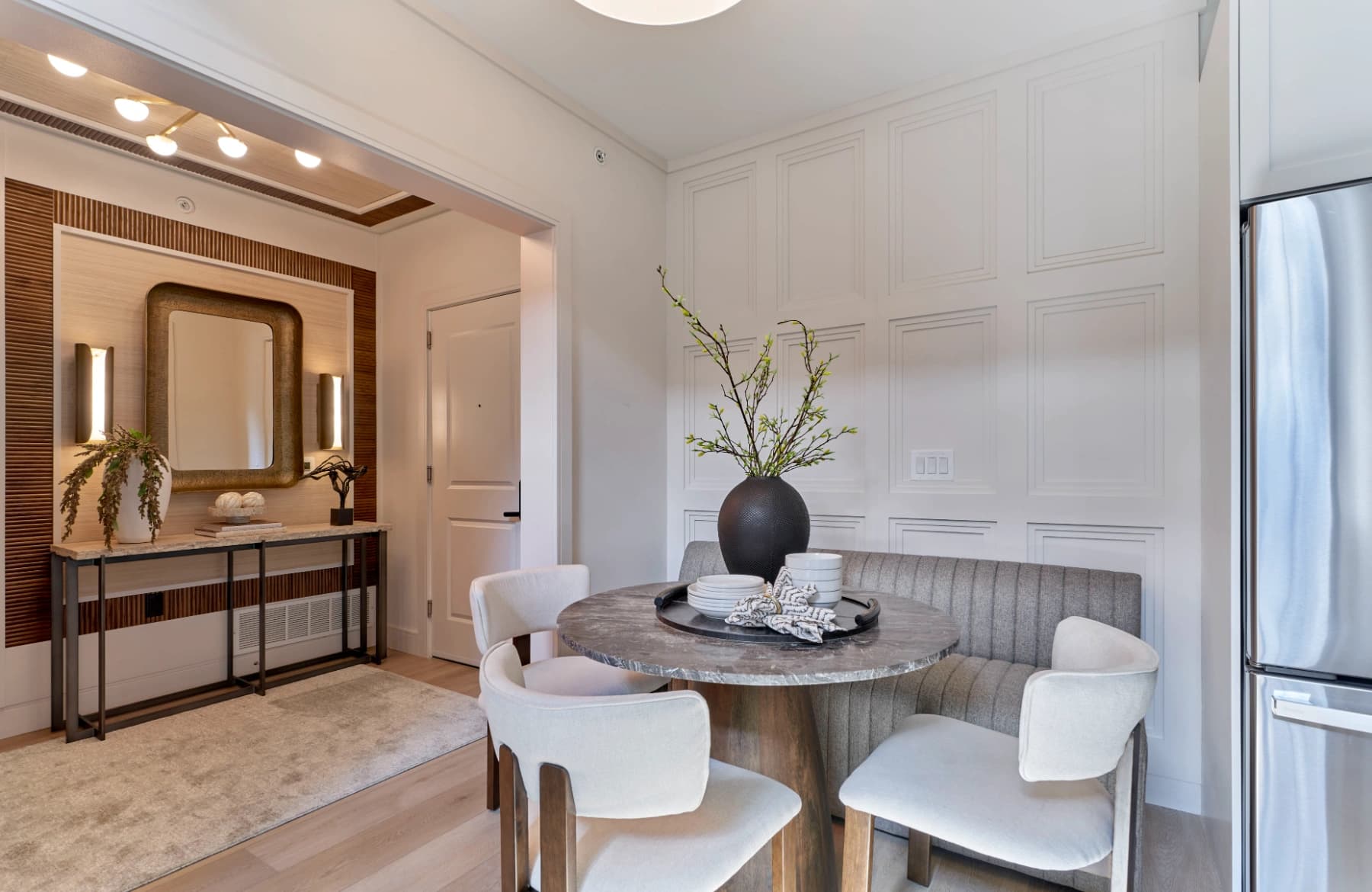 Liora residence dining area with entry console and mirror