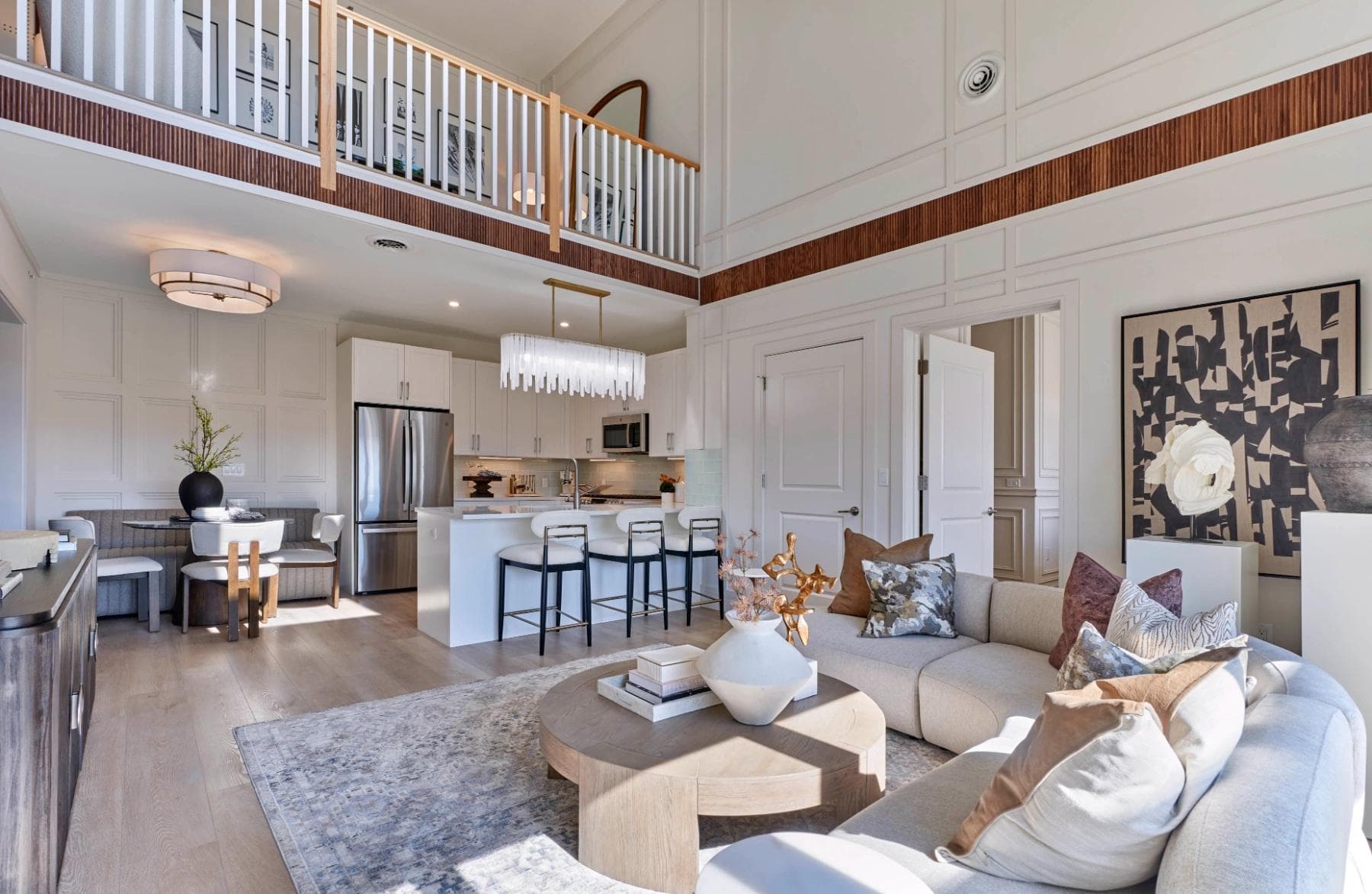 Open-concept Liora residence with double-height living room and kitchen